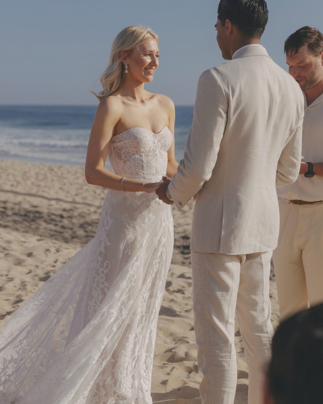 Kelly and Sameer exchanging vows on the beach in Todos Santos