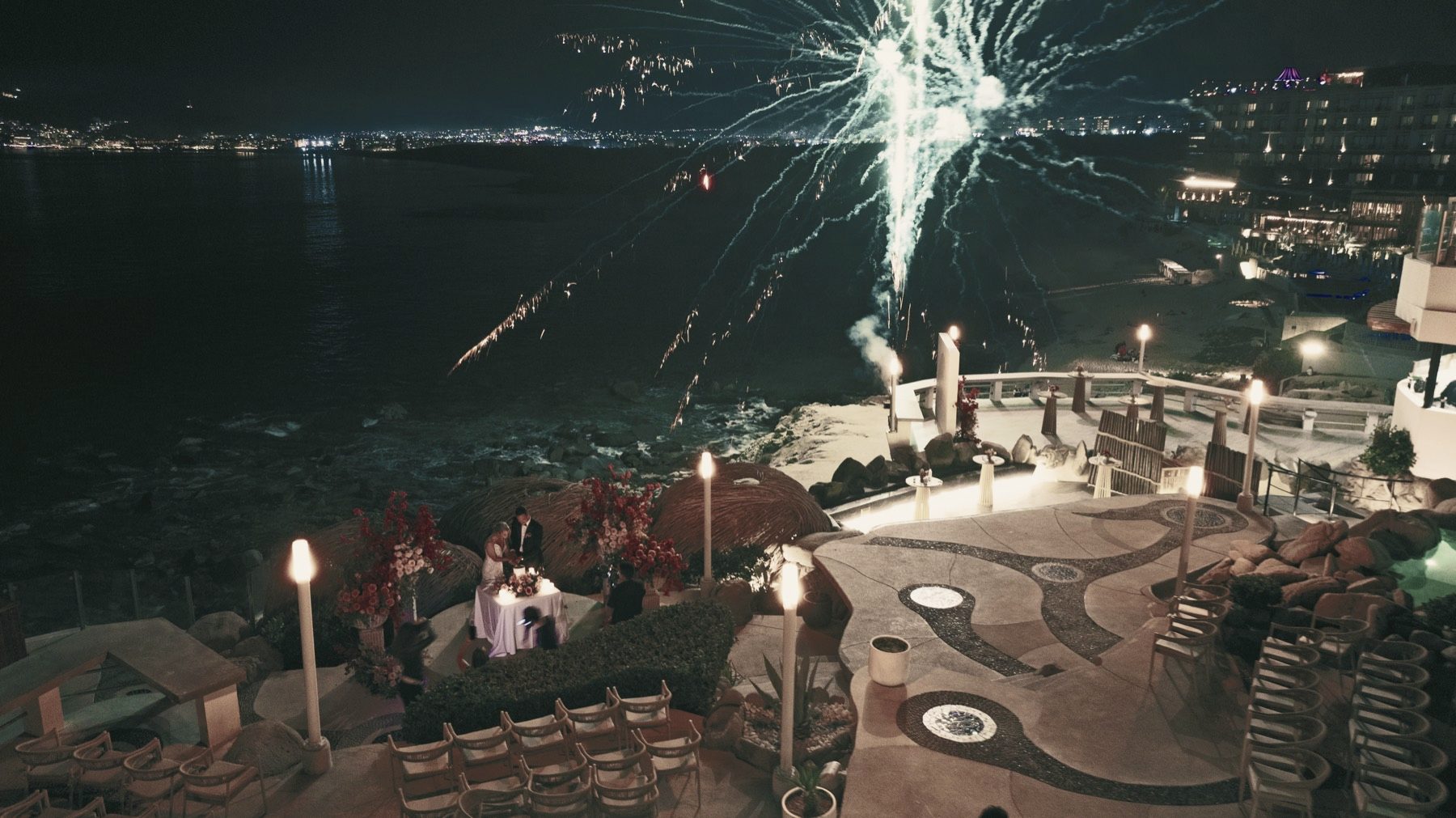 Fireworks over a clifftop celebration seen from the air