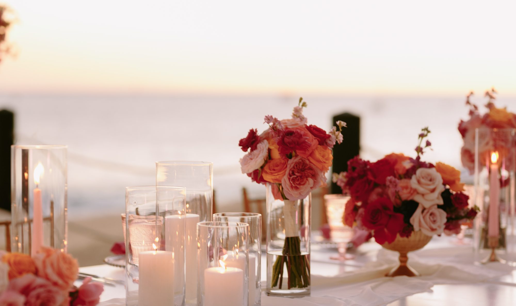 Stunning candlelit table with coral roses facing the Pacific at Grand Solmar