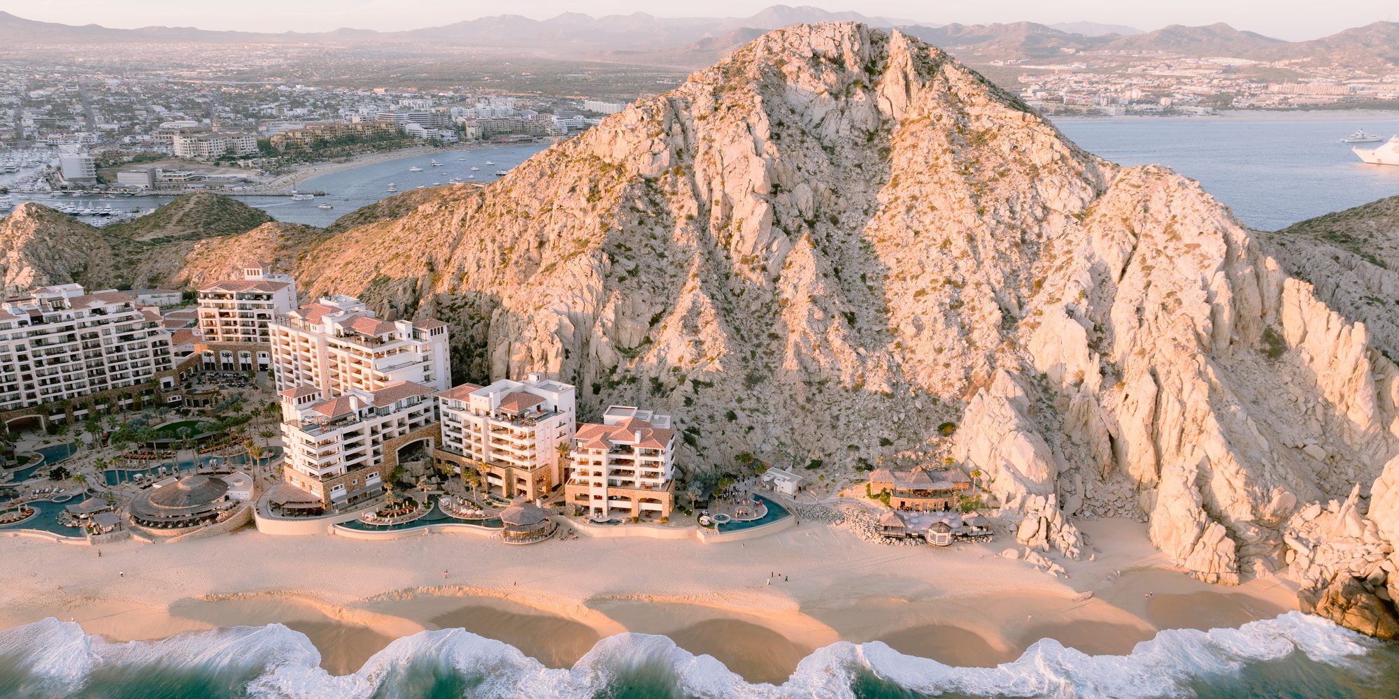 Aerial view of Land's End, Grand Solmar and the Pacific at sunset